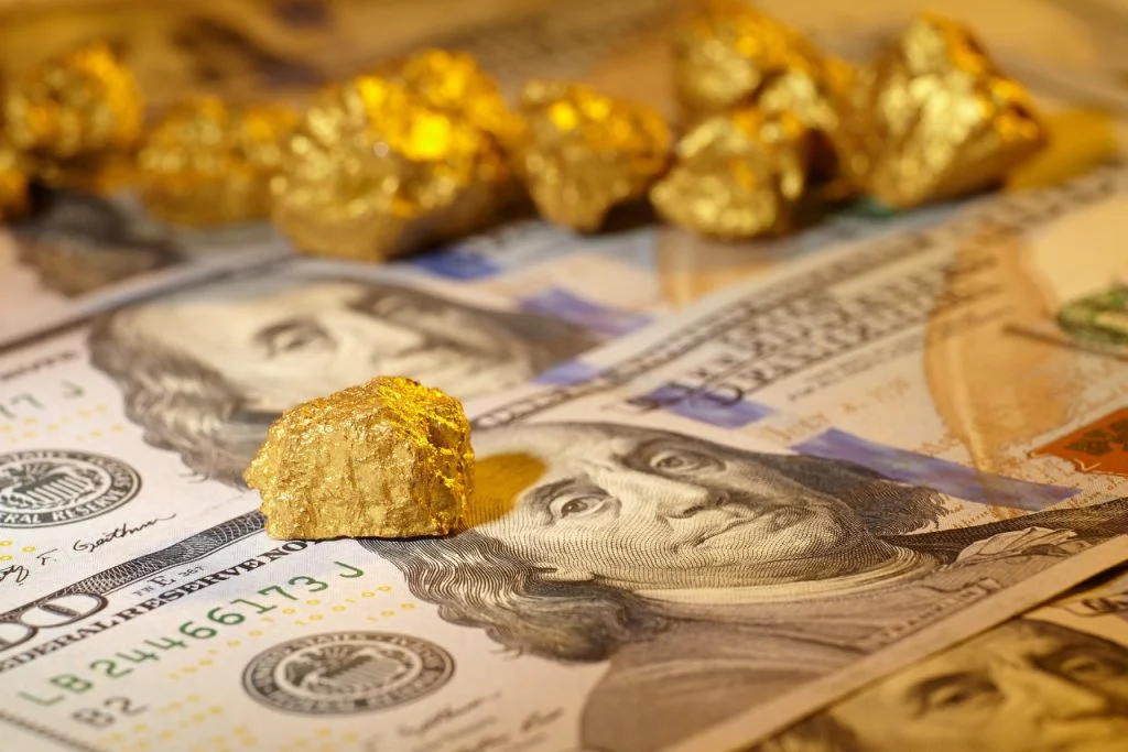 Gold and dollar bills